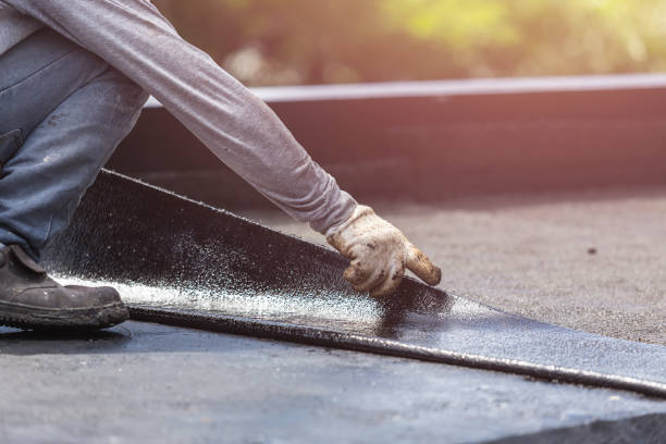 Professional Basement Waterproofing technician working in Buchanan, VA
